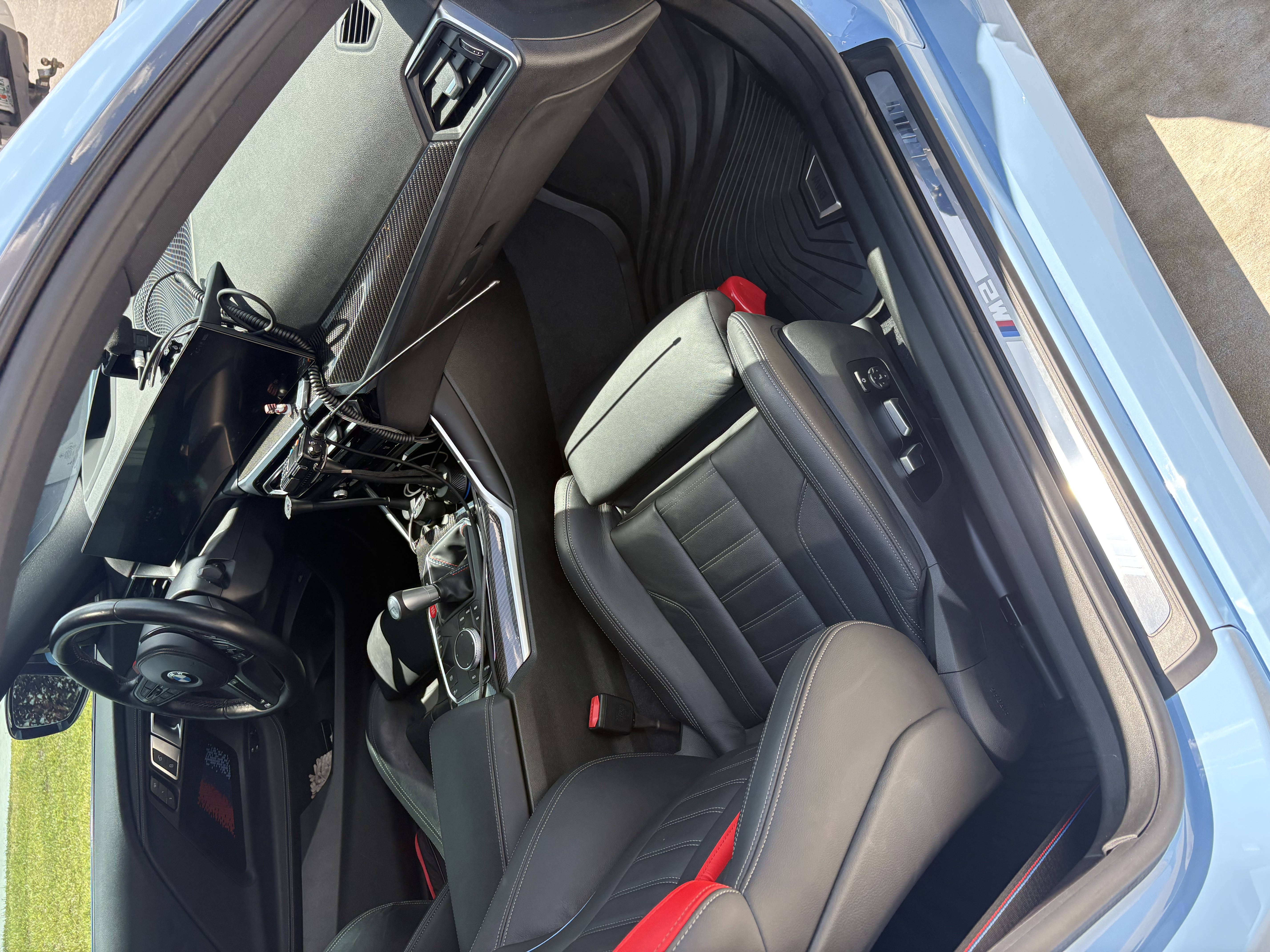 BMW M2 black and red interior after a full interior detail