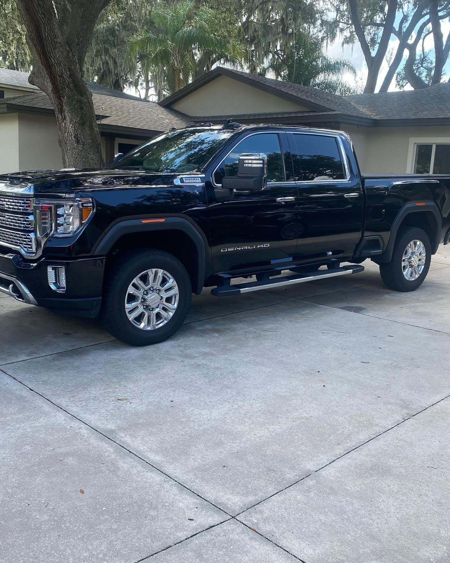 Black GMC Denali HD truck shining after mobile detailing