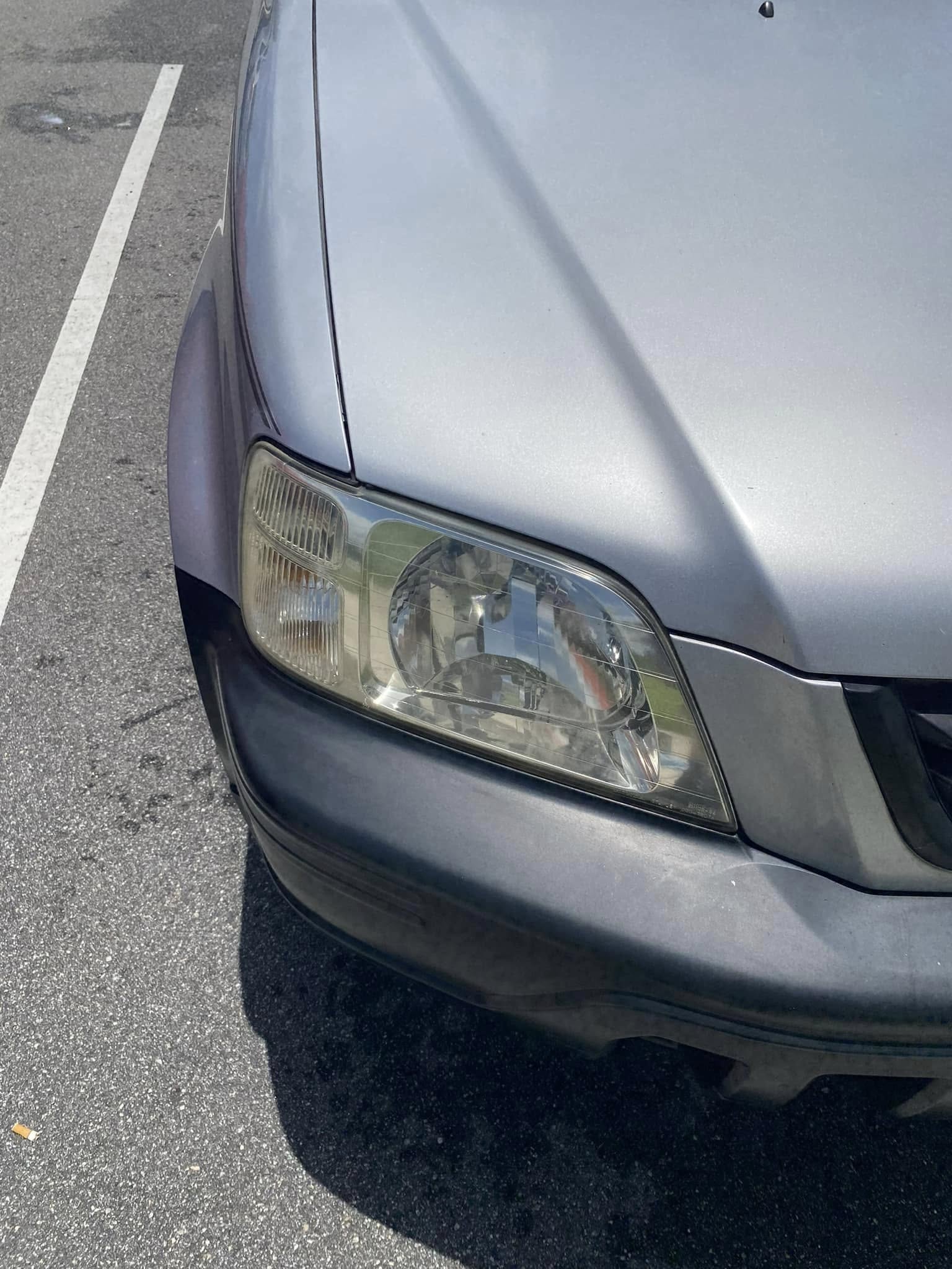 Restored, crystal-clear headlight on a silver SUV