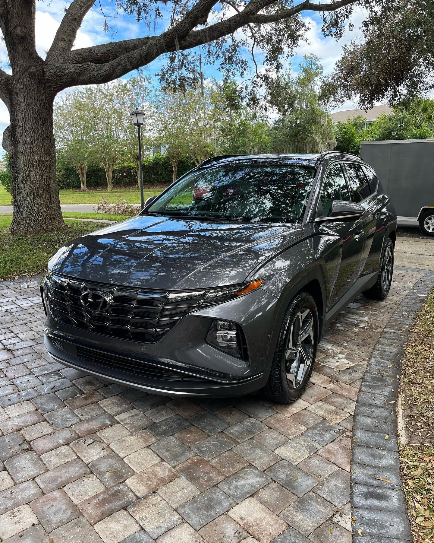 Gray Hyundai Tucson detailed on a paver driveway in Tavares, FL