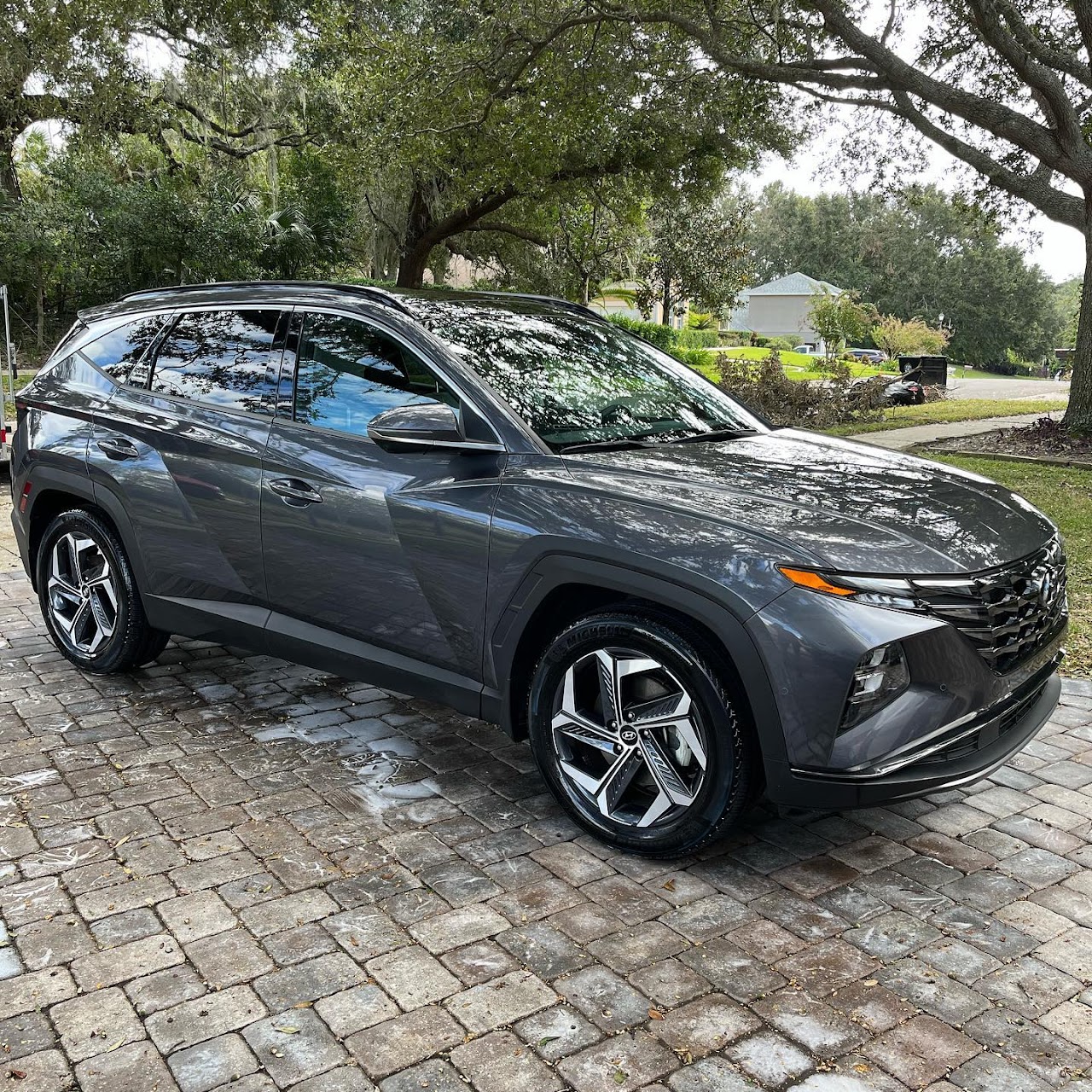 Hyundai Tucson SUV with glossy paint detailed in a driveway