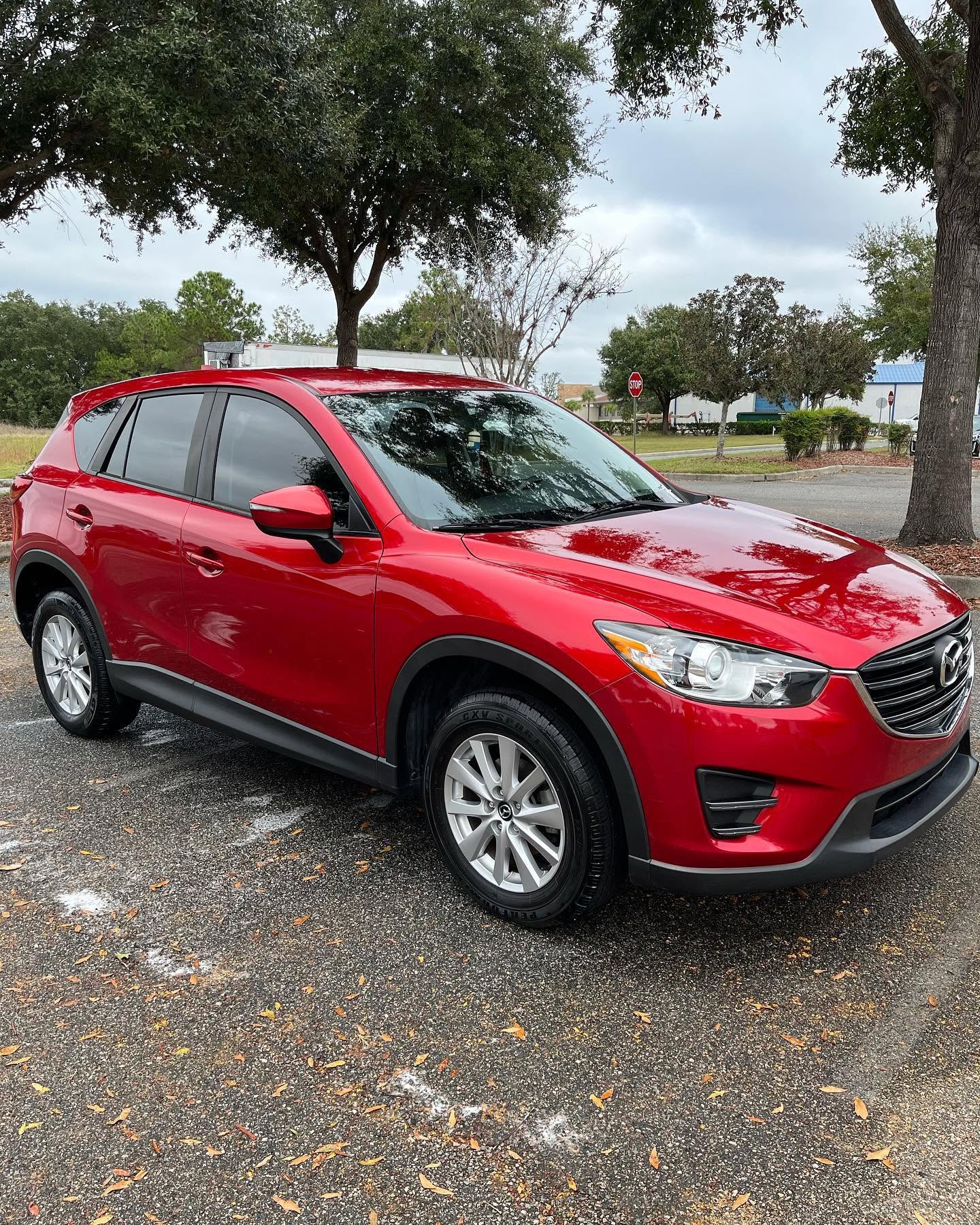Red Mazda CX-5 with a deep shine after exterior wash in Eustis, FL