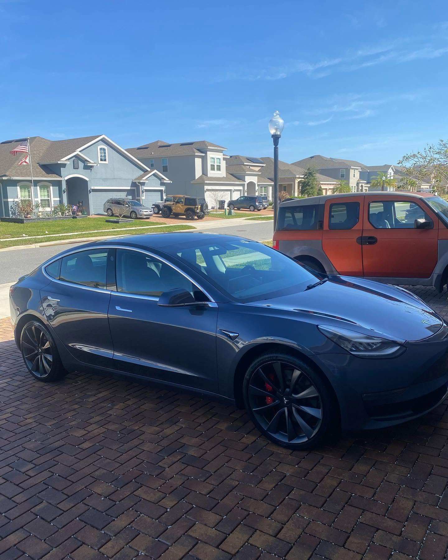 Gray Tesla Model 3 with ceramic coating in Clermont, FL